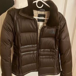 Brown puffer north face with fur on collar and wrists. Good condition